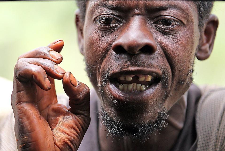 'We can spend 30 years and we'll never bounce back,' said Duvanel Francois, 42, who was trying to... [+] earn school fees one morning in a tiny village outside of Jeremie, the Grand'Anse capital, by helping another farmer rebuild his home. (Patrick Farrell/Miami Herald/TNS via Getty Images)