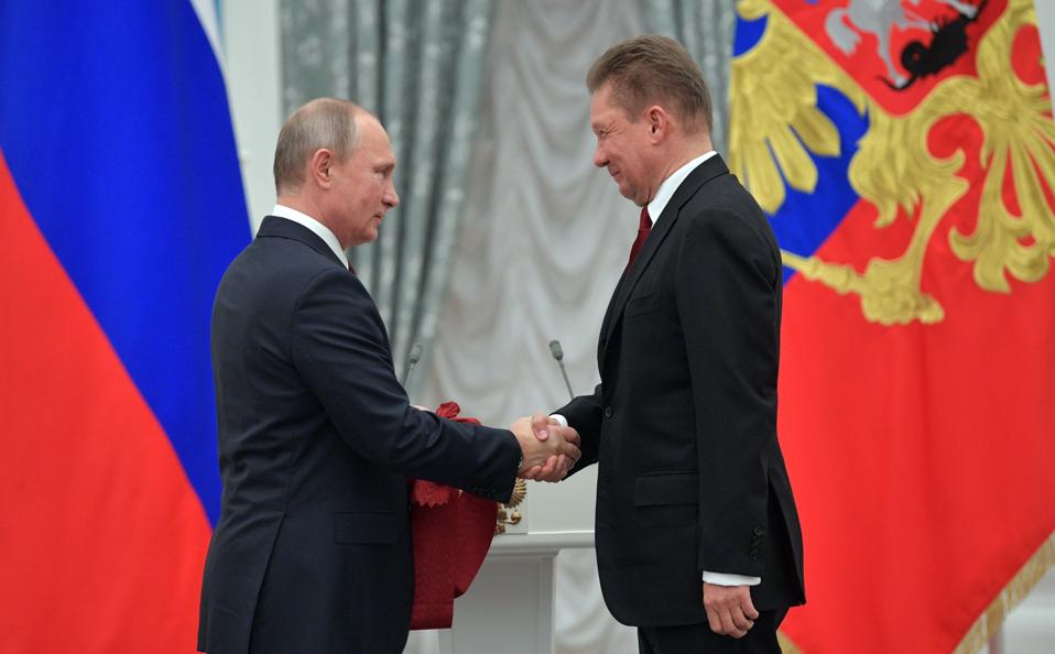 Vladimir Putin with Gazprom CEO Alexei Miller during an awards ceremony on November