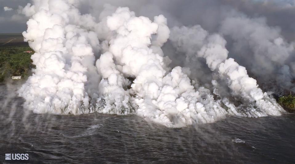 Lava from a fissure flowing into the ocean at Kapoho Bay at the town of Kapoho on the island of Hawaii.