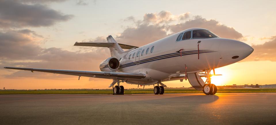 Business Jet on Ramp with Sun in Background
