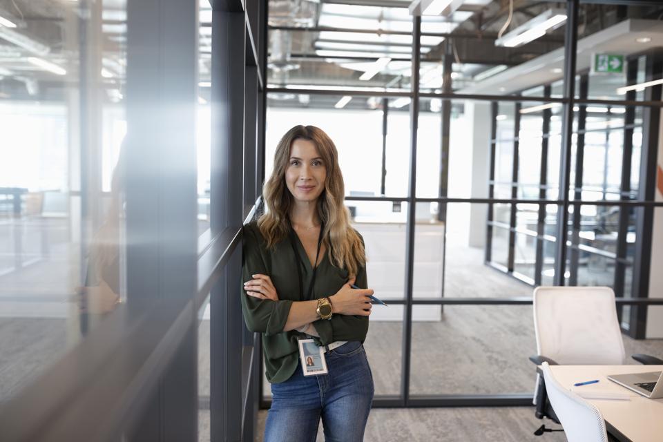 Portrait confident businesswoman in conference room