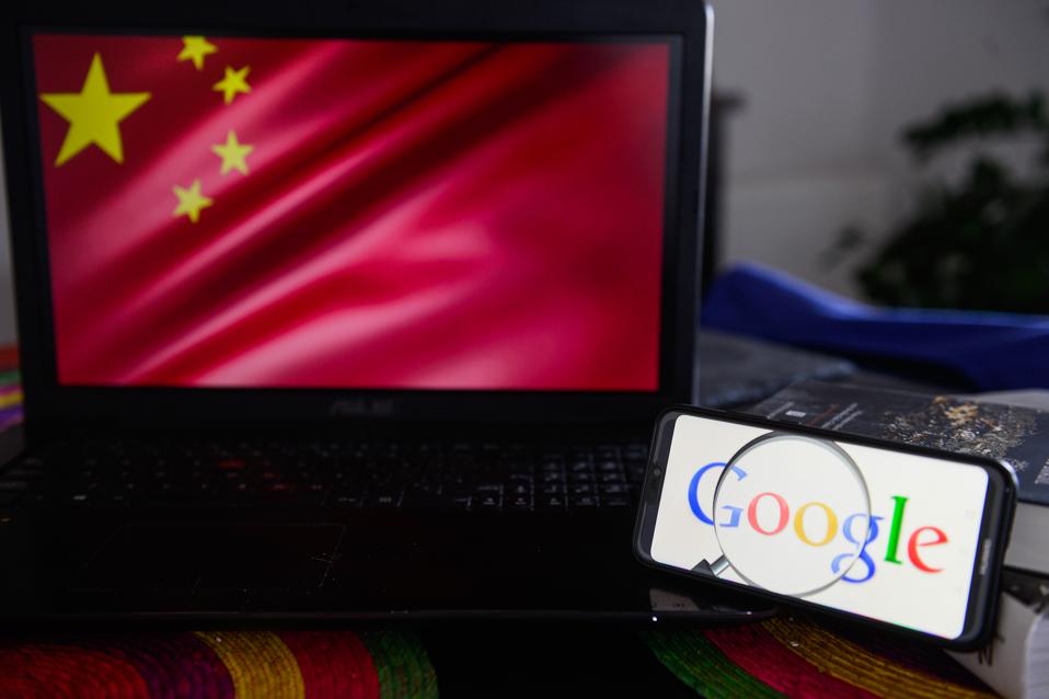 Google logo is seen on a Huawei smart phone with China's