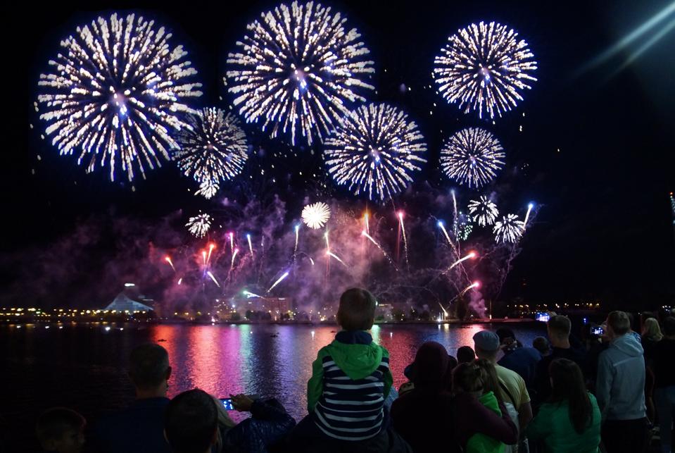 Crowd Looking Firework Display At Night