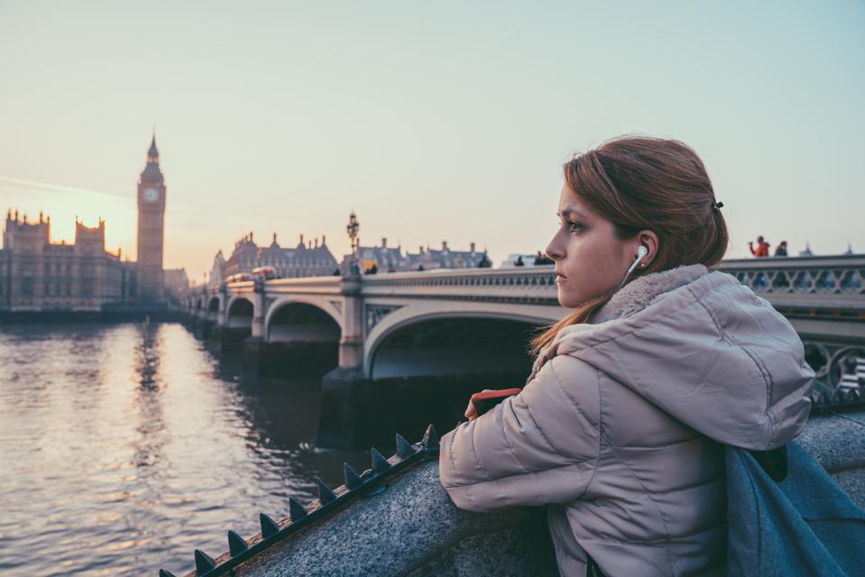 Melancholy woman in London staring the cityscape