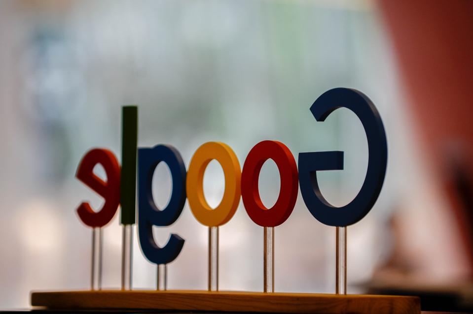Google sign is seen on Google stand info point during the...
