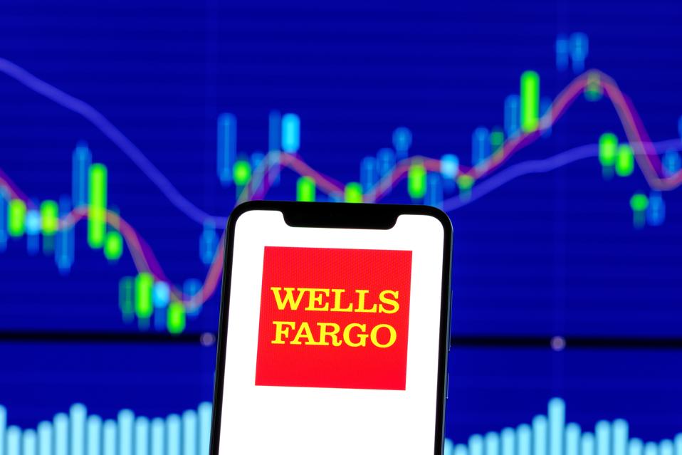 Wells Fargo logo is seen on an android smartphone over stock