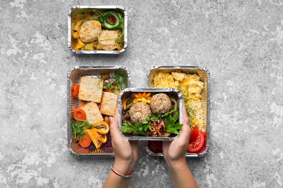 Foil containers of food.