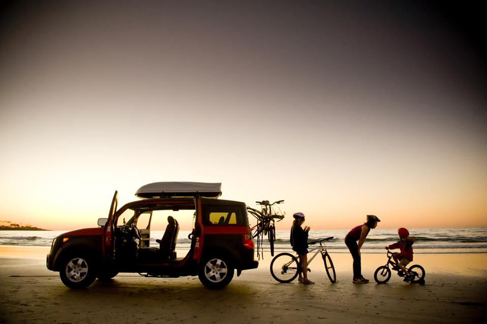 Americans are traveling this summer. But they're staying close to home and driving to their destinations.