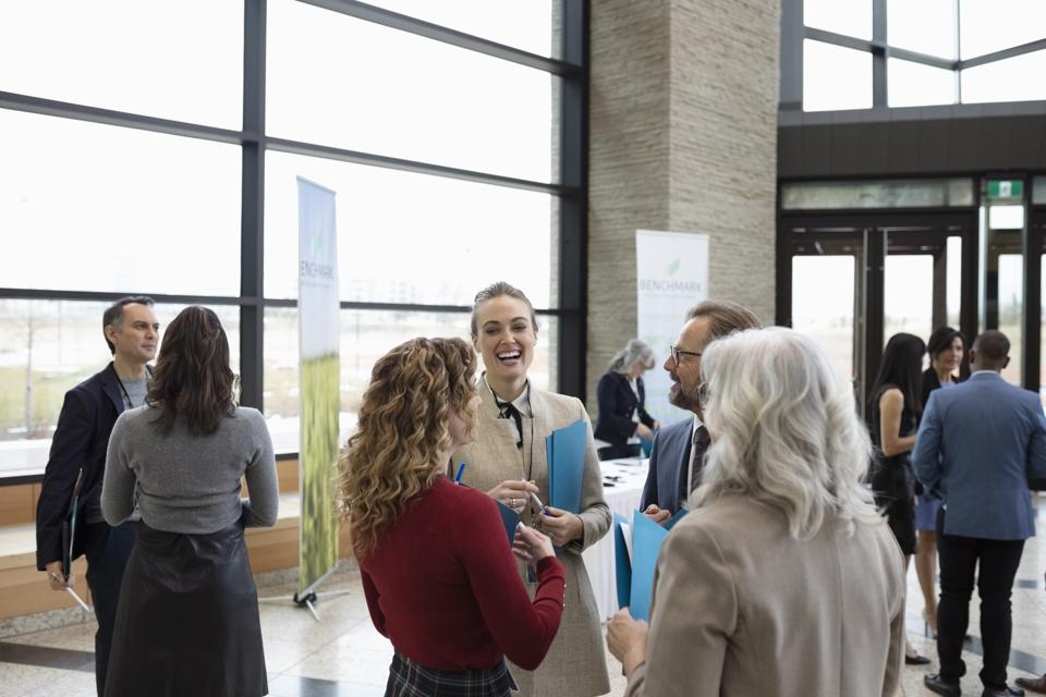 Business people networking at conference