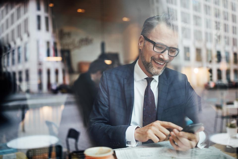 Businessman working on phone.