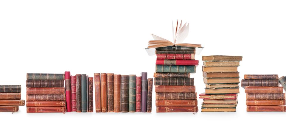Old books row isolated on white with clipping path