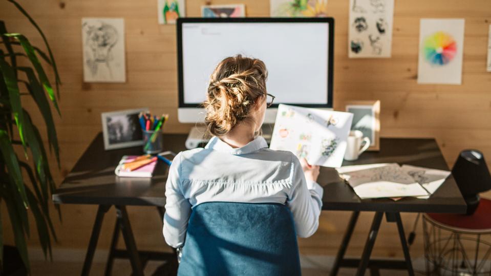 Female Graphic Designer Working In Creative Office Studio