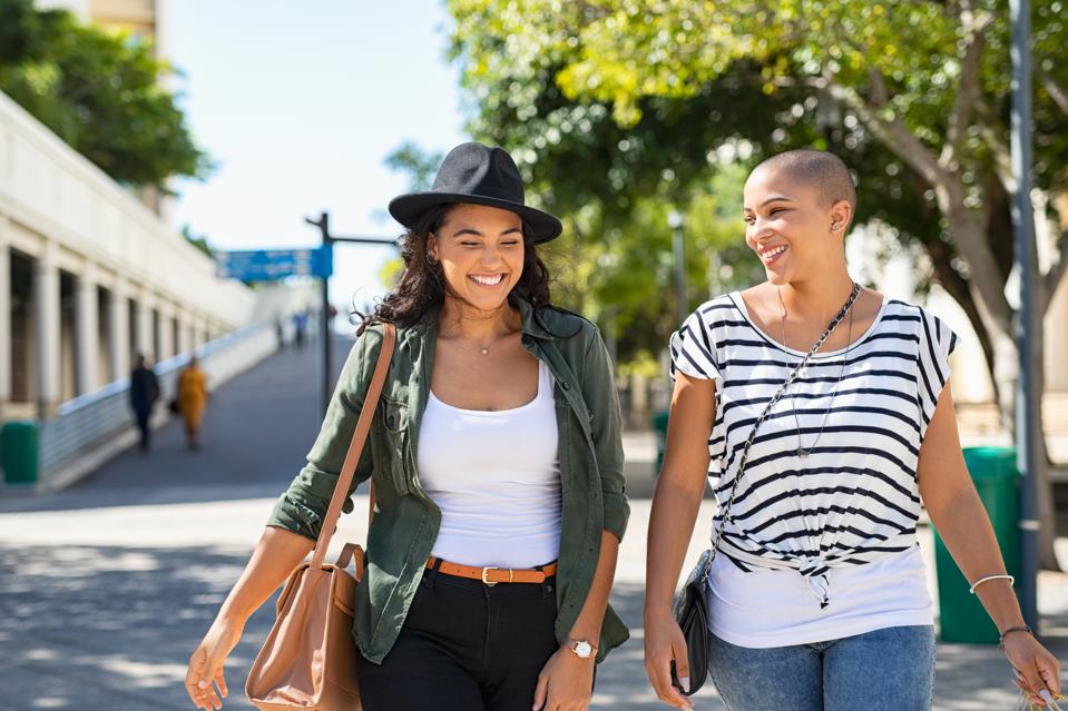 Two girls friends walking together