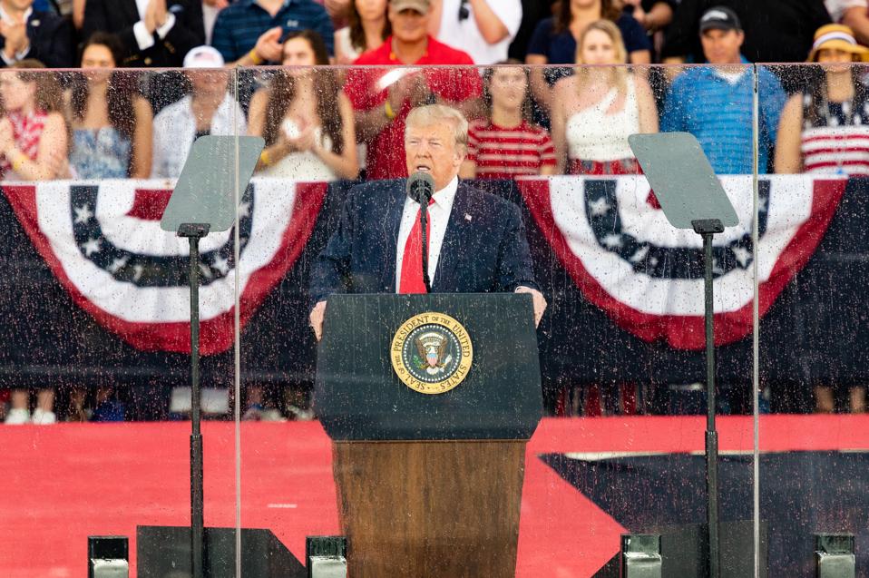 President Donald Trump speaking at the National Mall in...