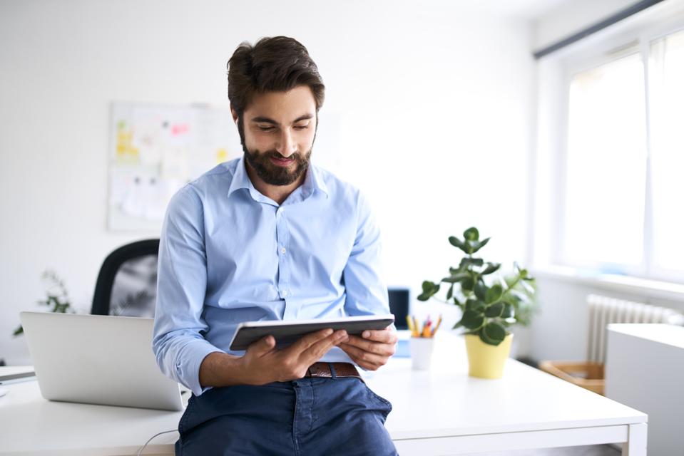 Businessman using a digital tablet in his office