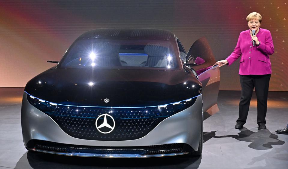 German Chancellor Angela Merkel stands next to a battery powered Mercedes Vision EQS car at the International Auto Show in September.