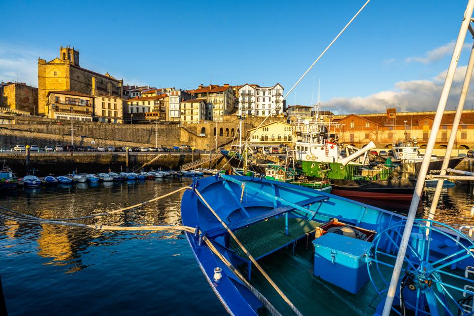 Colorful fishing boats moored at Getaria port, Basque Country, Spain
