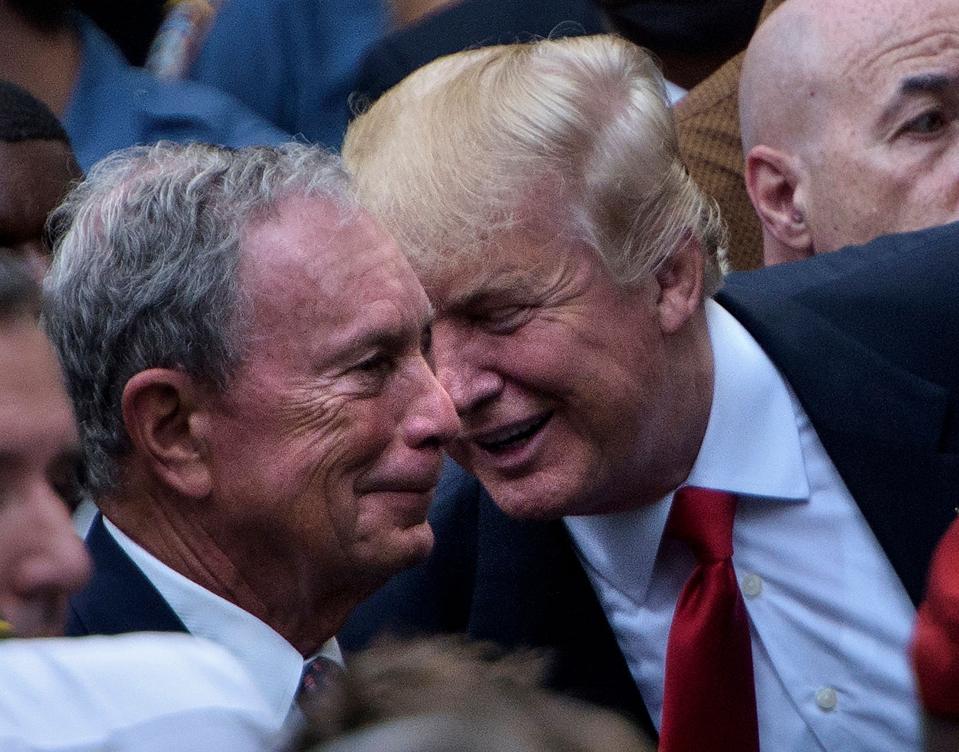 The presidential nominee Donald Trump spoke to former New York City Mayor Michael Bloomberg during a memorial service at the National 9/11 Memorial September 11, 2016 in New York.
