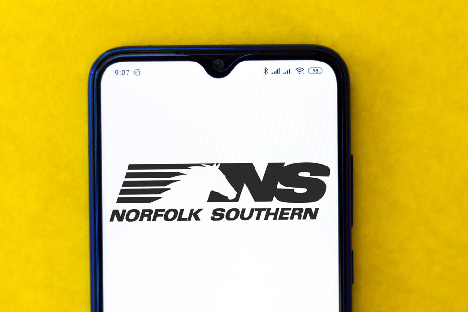 In this photo illustration a Norfolk Southern logo seen...