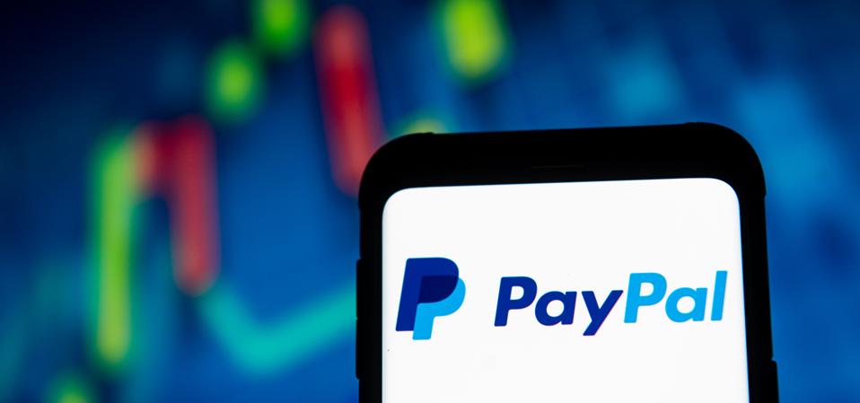 In this photo illustration a Pay Pal logo seen displayed on...