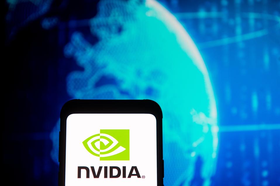 In this photo illustration a Nvidia logo seen displayed on a...