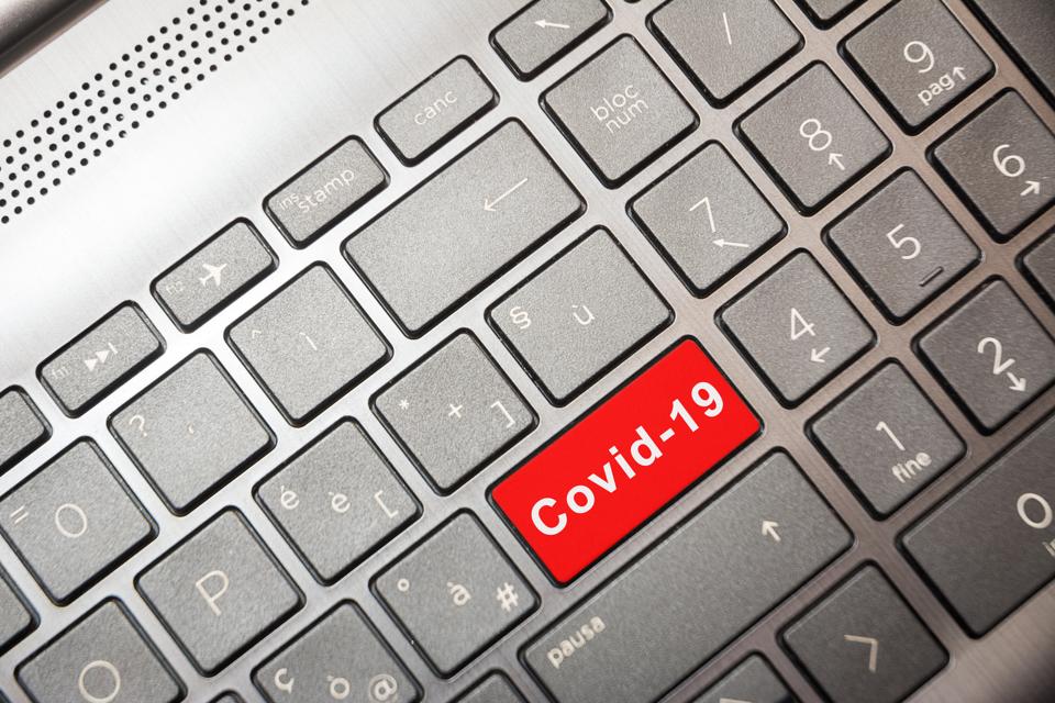 PC key with the red word Covid-19