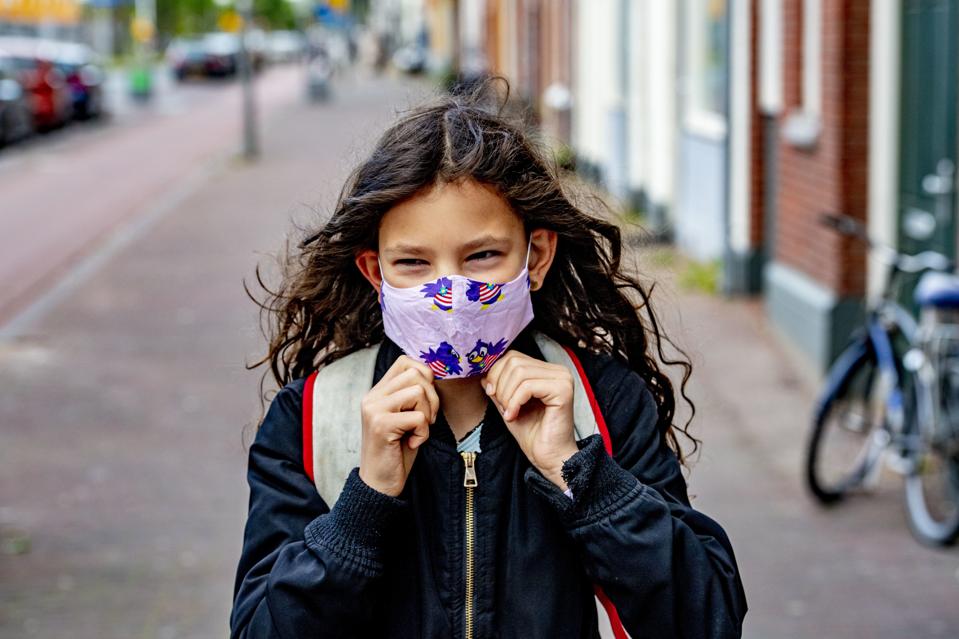 A child going to school while wearing a face mask