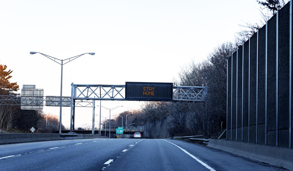 New York State Highway Road Sign ″Stay Home″ Covid-19 Coronavirus