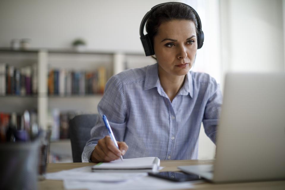 Mature woman working from home during COVID-19 pandemic