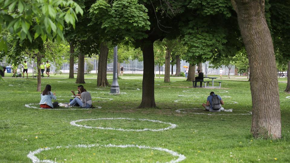 Image: https://specials-images.forbesimg.com/imageserve/1215858455/People-sit-in-pre-drawn-circles-in-a-park-in-Toronto/960x0.jpg?cropX1=0&cropX2=5472&cropY1=277&cropY2=3355 People sit in pre-drawn circles in a park in Toronto