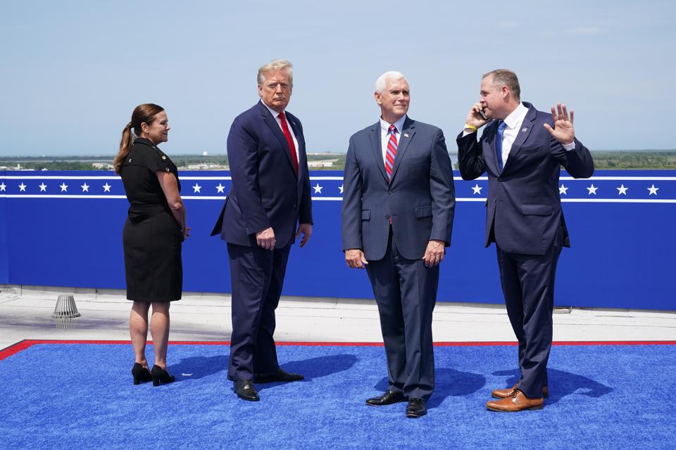Bridenstine from NASA standing next to Mike Pence, Donald Trump, and Karen Pence.