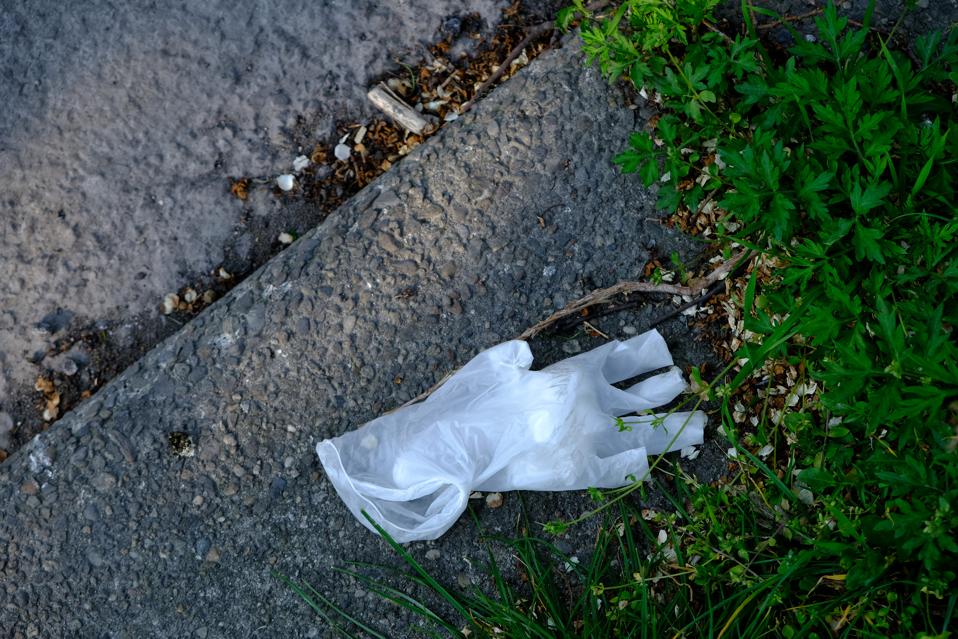A used latex glove is abandoned as rubbish on a street floor on April 06, 2020 in Milan, Italy.
