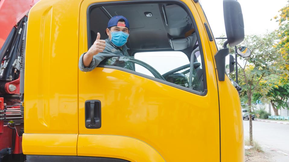 Truck driver wearing a mask