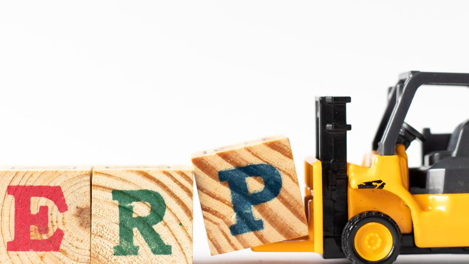 Toy forklift hold wood letter block P to complete word ERP (Abbreviation of Enterprise Resource Planning) on white background