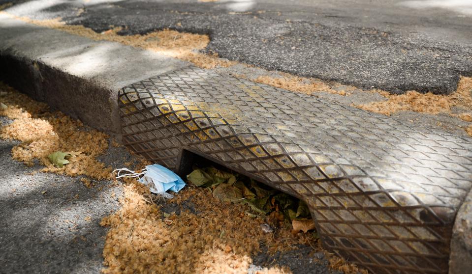 A used mask is abandoned near a sidewalk on May 11, 2020 in Rome, Italy.