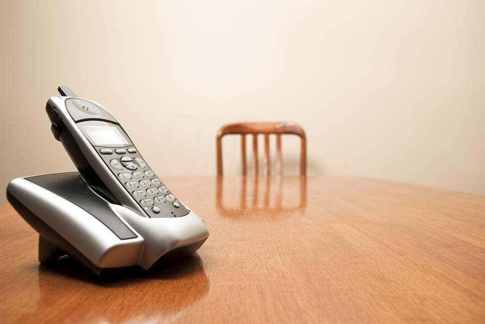 Modern cordless phone sitting on a table