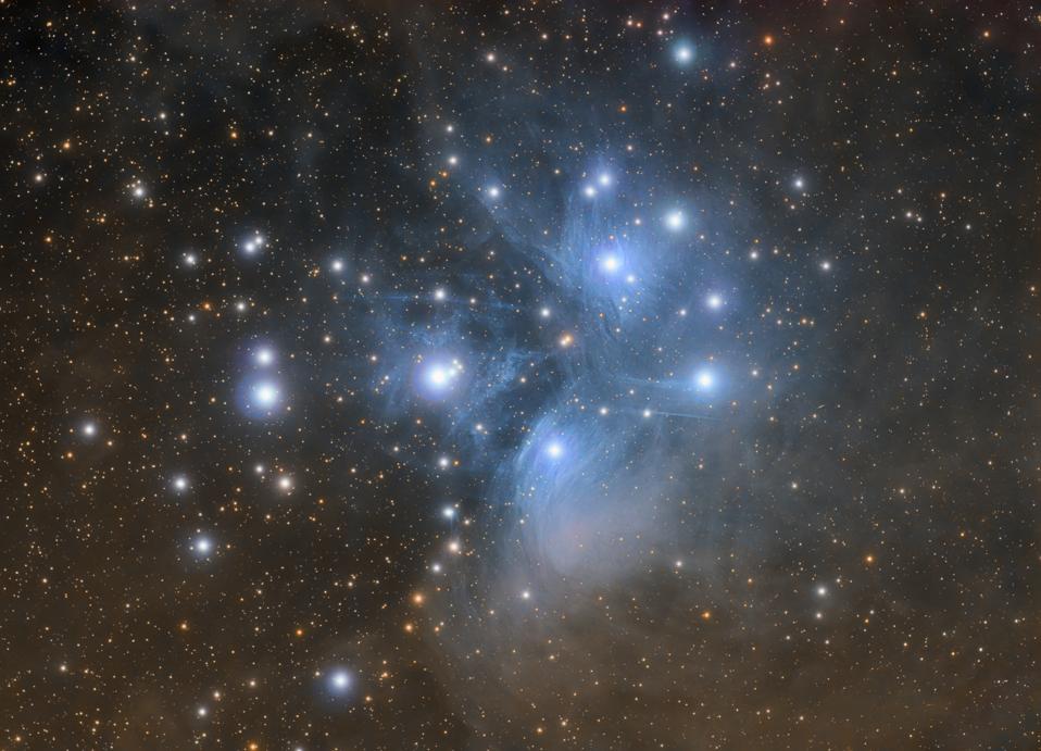 Pleiades open star cluster with nebula (Messier 45) in constellation of Taurus photographed with high quality amateur telescope.