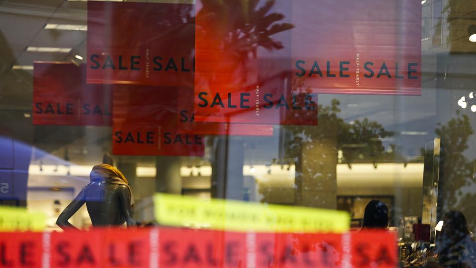 Red sale signs hang in a Nordstrom store in Santa Monica, California,