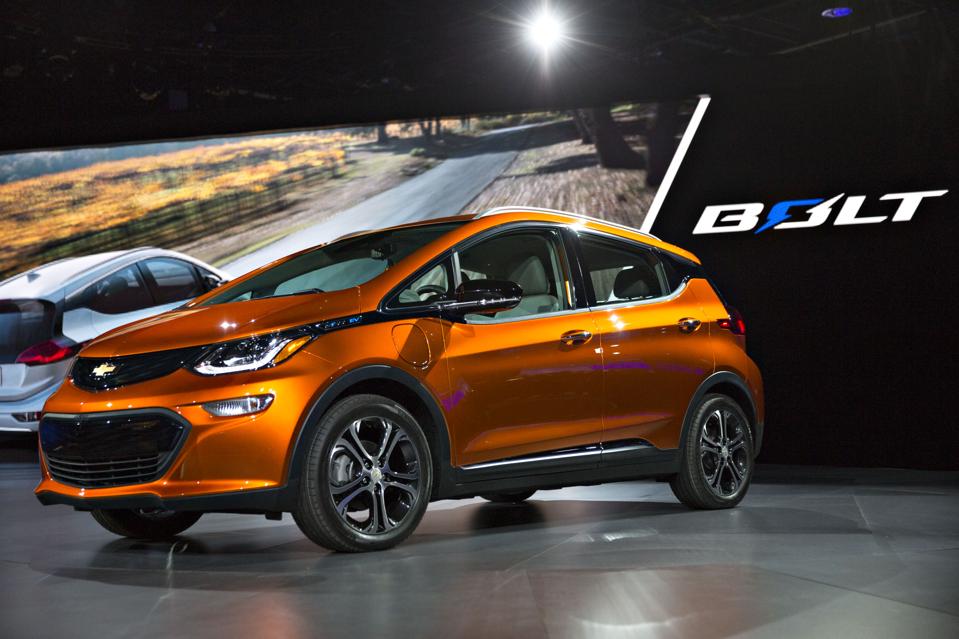 Parts that do not need to be replaced in electric vehicles, such as the Chevrolet Bolt in this picture, include fan belts and air filters.