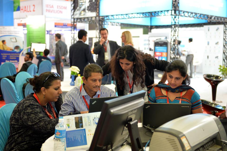 Participants prepare to take part in the IBM Hackathon, a marathon 24-hour free-coding event.... [+] (MANJUNATH KIRAN/AFP/Getty Images)