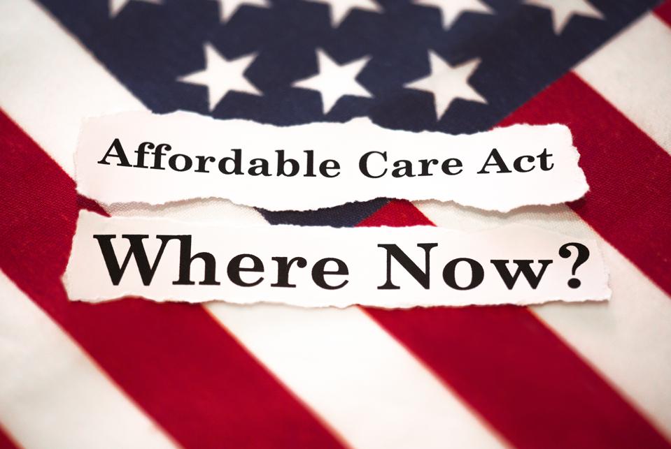 The American flag with words saying affordable care act