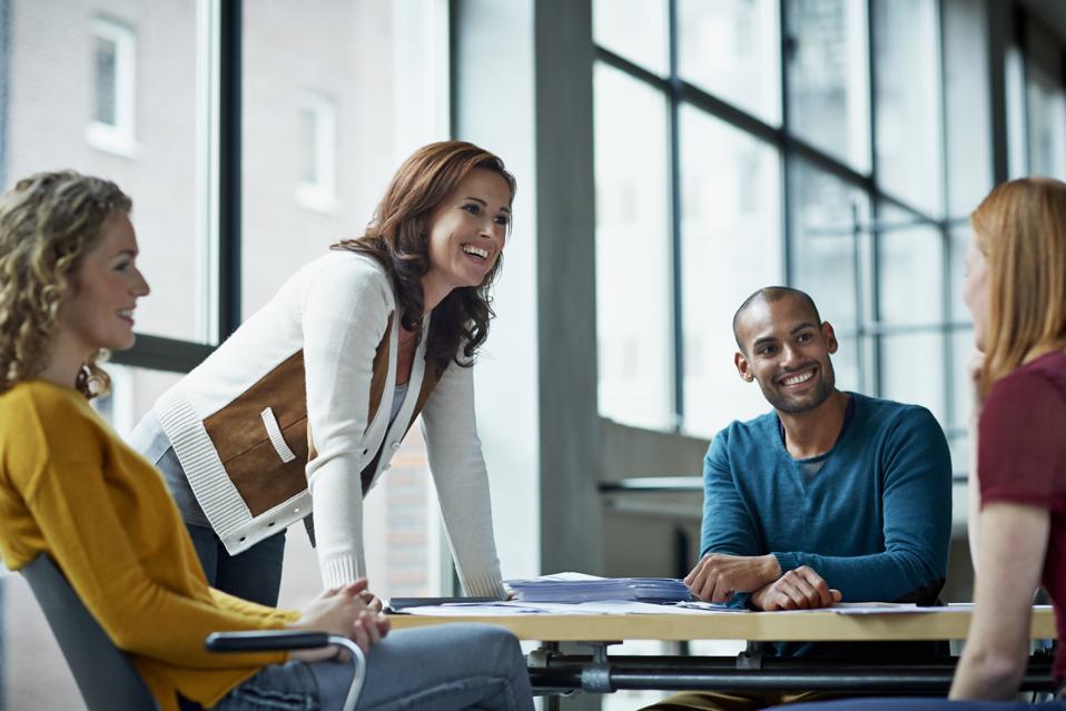 Smiling coworkers in meeting