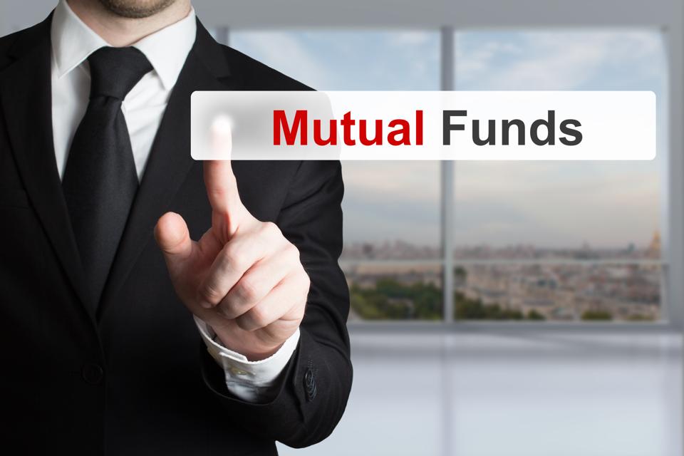 businessman pushing touchscreen button mutual funds