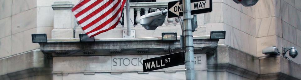 Wall Street Sign With US Flag In New York City