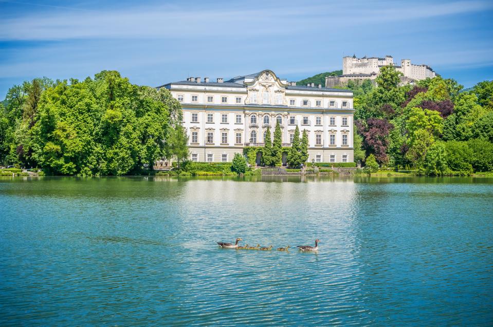 Famous Schloss Leopoldskron with Hohensalzburg Fortress in Salzburg, Austria