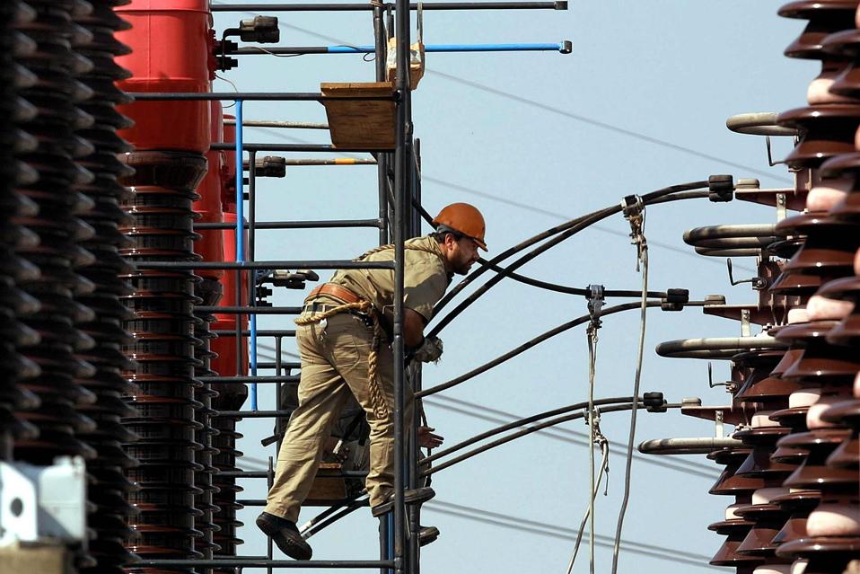 A technician at an EPTE electrical facility in Brazil in 2001.