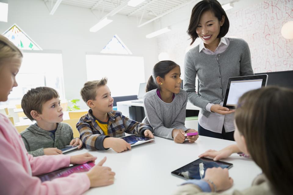 Elementary students watching teacher with digital tablet
5 Unique Learning Conferences For Entrepreneurs And Educators To Attend In 2020