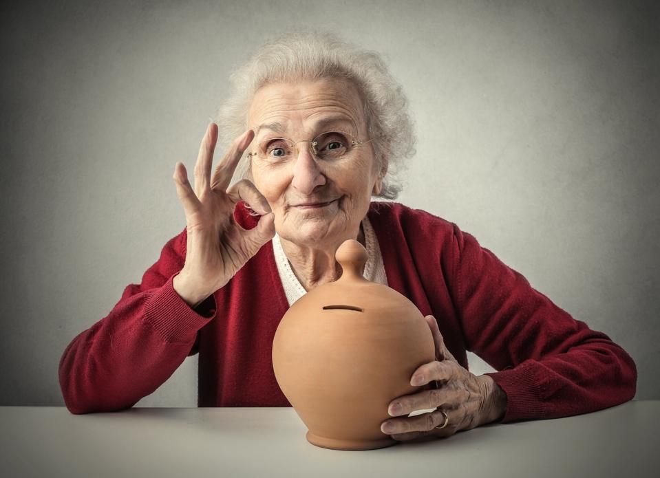 Happy Old lady with her saving