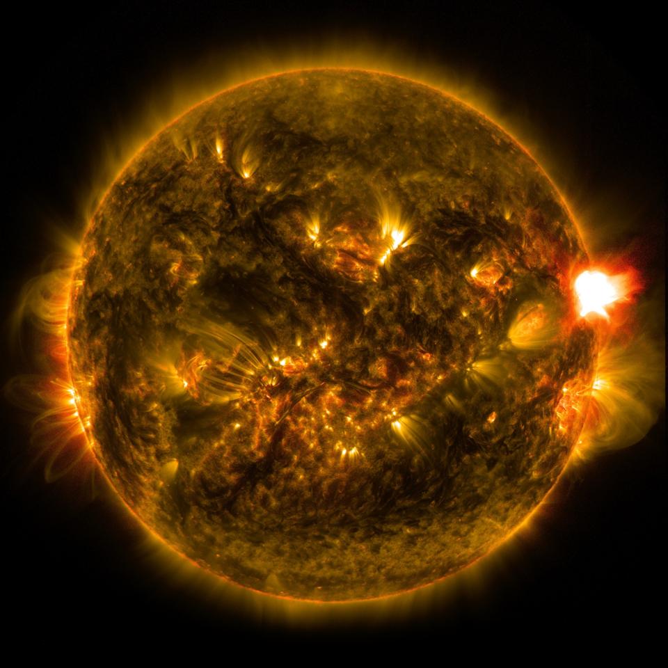 A solar flare, at right, occurs when magnetic field lines split apart and reconnect.