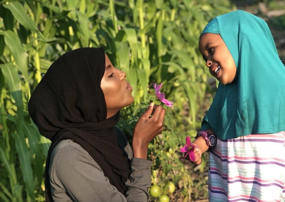Student, activist and model Hamdia Ahmed with her three-year-old niece, Zamzam.